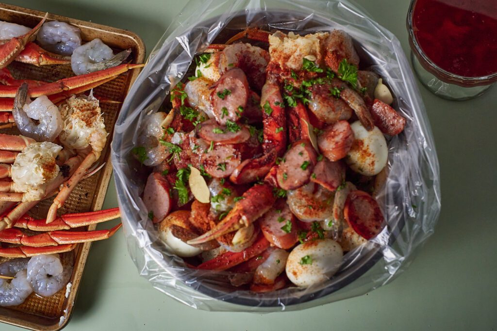 seasoned seafood boil ingredients in bag before putting in oven.