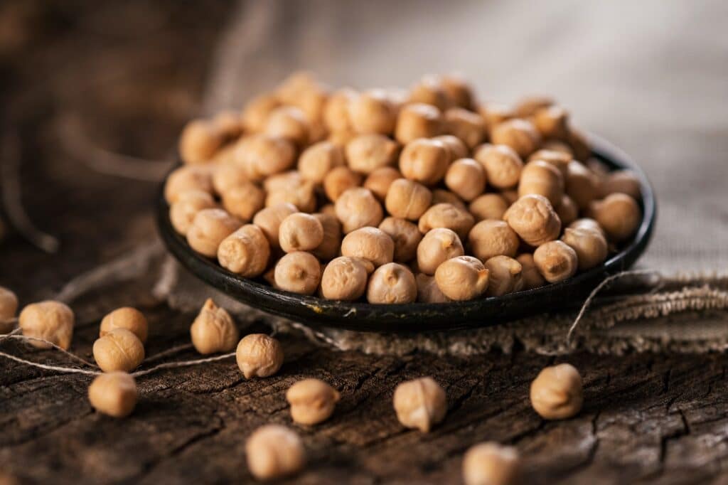 Organic chickpea on wooden background