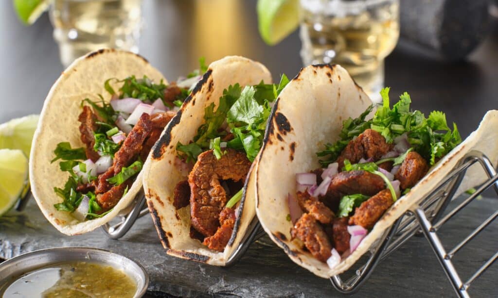 metal taco holder with three mexican carne asada street-tacos