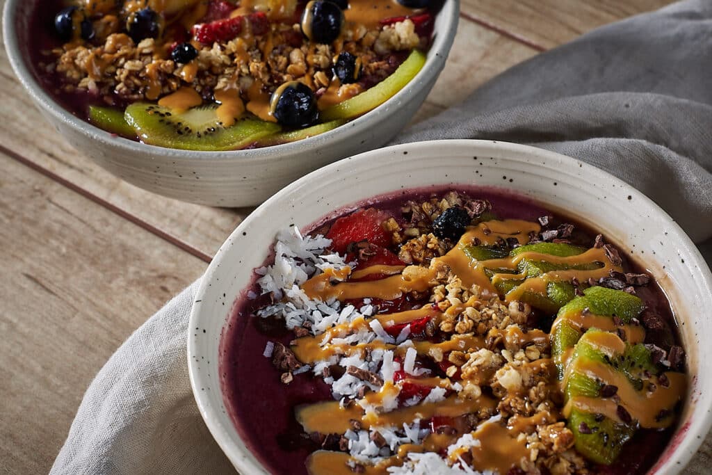 two bowls of acai smoothie bowls