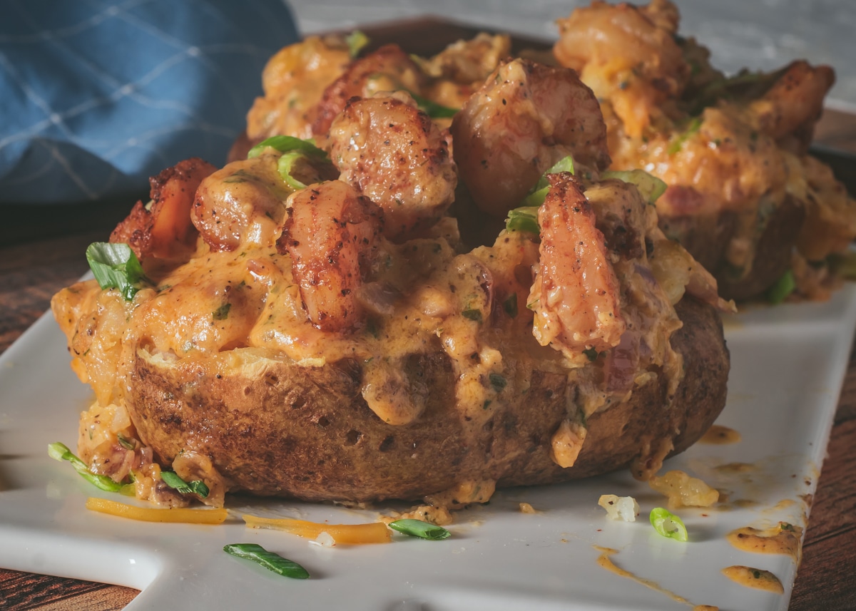Loaded Seafood Baked Potato with Creamy Cajun Shrimp Sauce