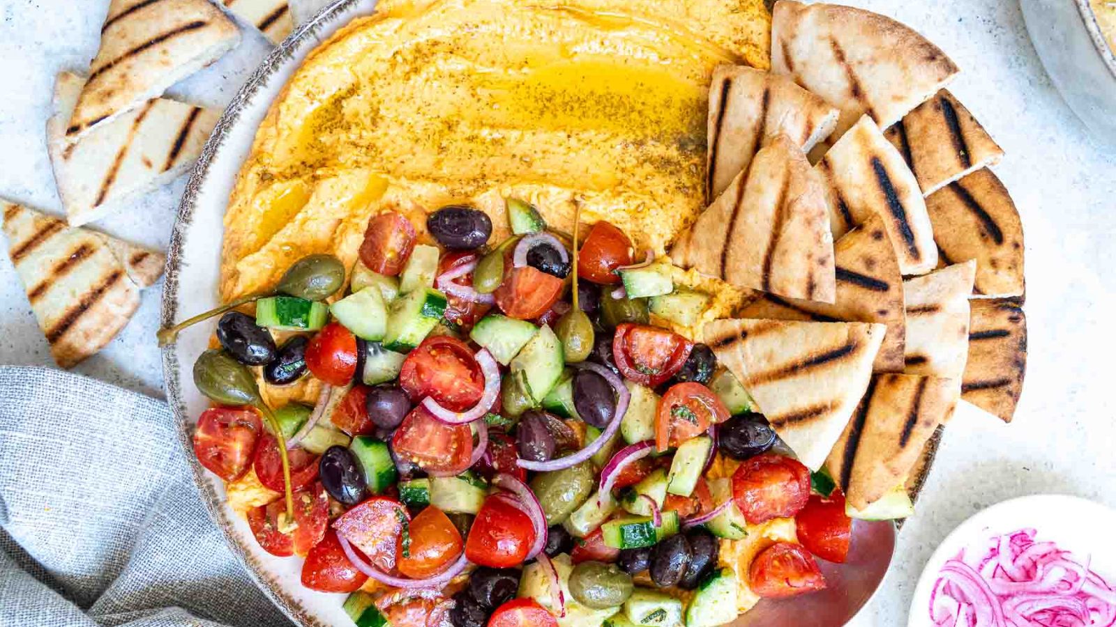 Mediterranean Loaded Hummus by Six Hungry Feet