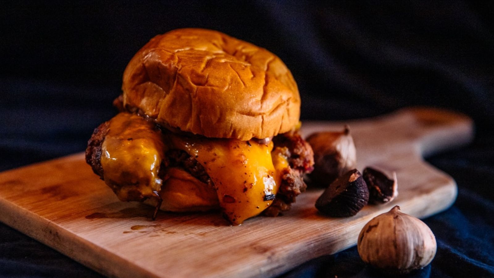 From Small Screen to Big Flavors: 14 TV Recipes Worth Breaking the Fourth Wall Bob's Burgers Black Garlic Burger by Soul Homesteading