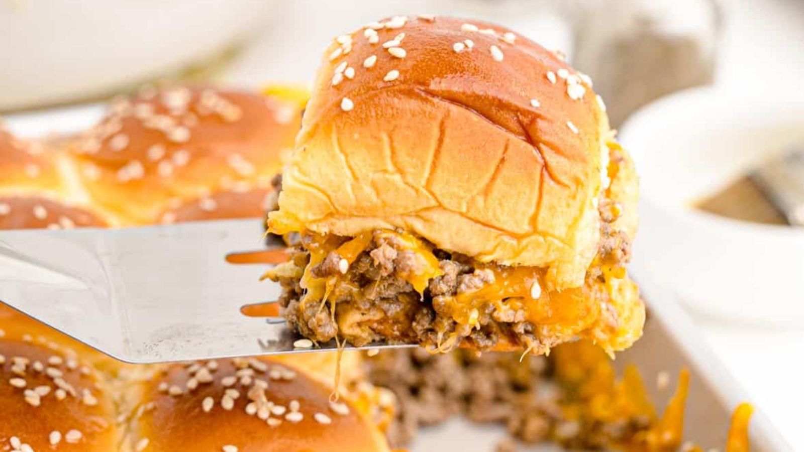 Small But Mighty: 21 Slider Recipes That Pack a Punch Cheeseburger Sliders by Busy Family Recipes