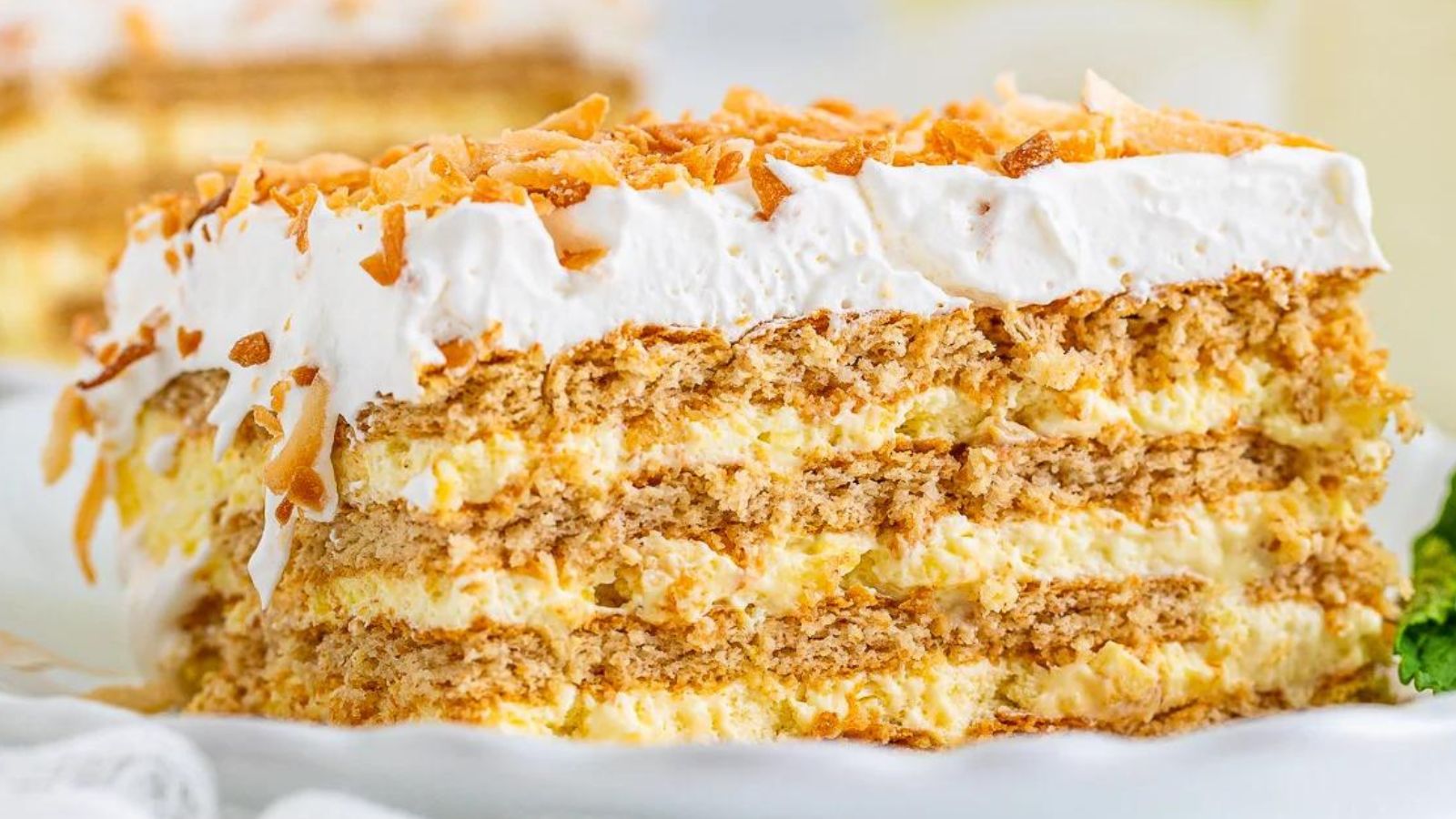 14 Icebox Cakes That'll Give You The Chills (In a Good Way) Coconut Icebox Cake with Graham Cracker by The Silly Girl's Kitchen