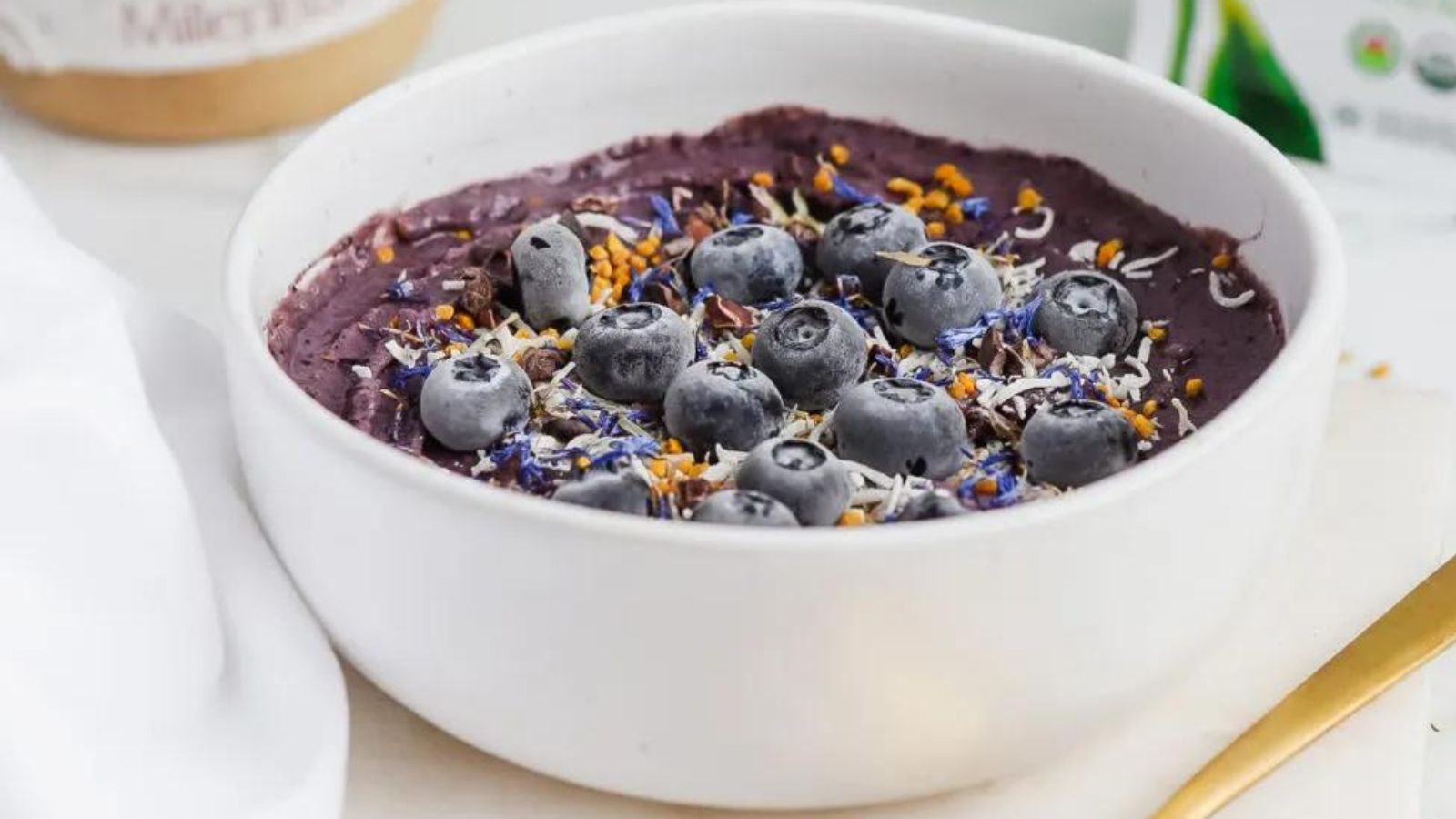 Too Pretty to Eat? 15 Vibrant Smoothie Bowls Creamy Blueberry Cauliflower Smoothie Bowl by Basics with Bails