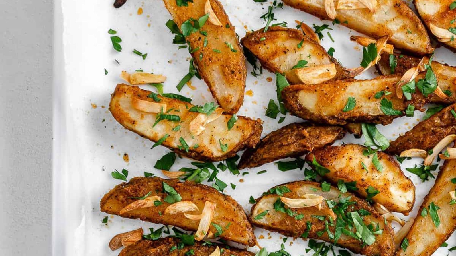All Eyes on These 21 Irresistible Baked Potatoes Crispy Garlic Baked Potato Wedges by Plant Based On a Budget
