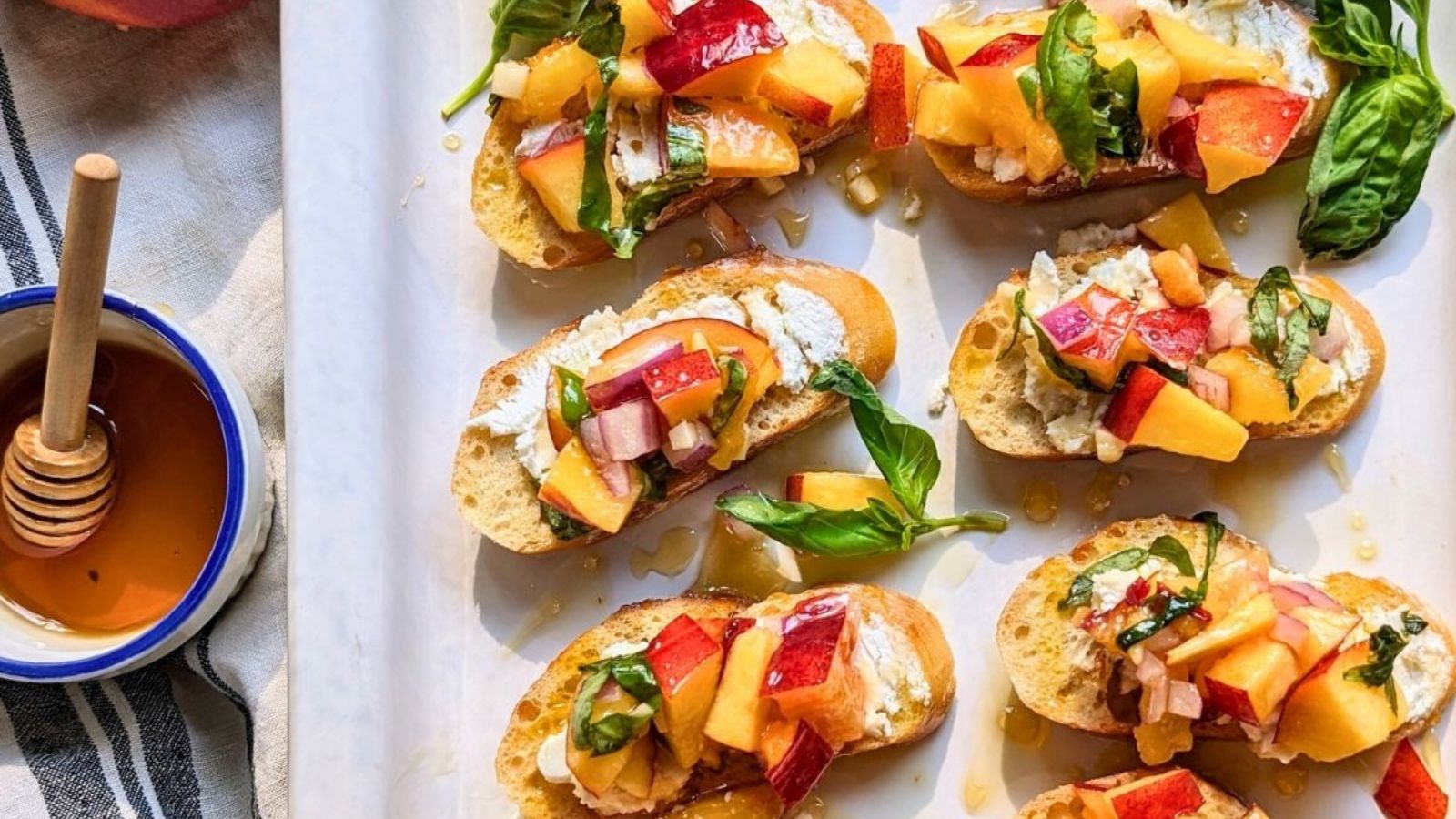 Peachy Keen Eats: 11 Savory Peach Recipes Peach Bruschetta with Goat Cheese and Honey by The Herbeevore