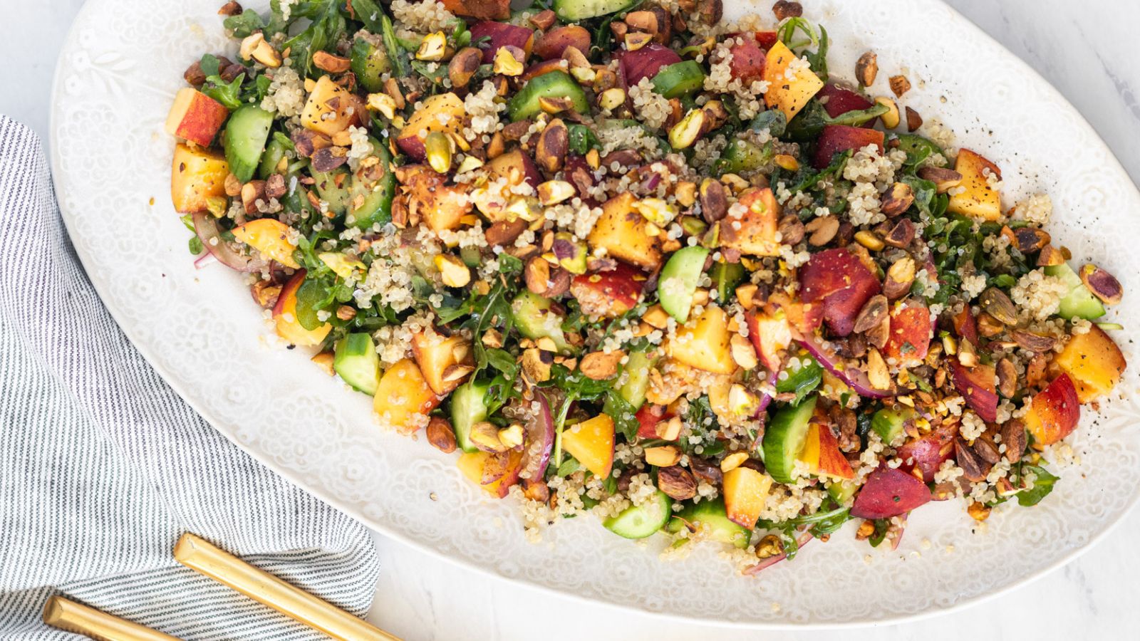 Picnic Like a Pro: 25 Crowd Pleasing Sides You Haven't Tried Yet Peach Quinoa Salad by With Thyme Nutrition