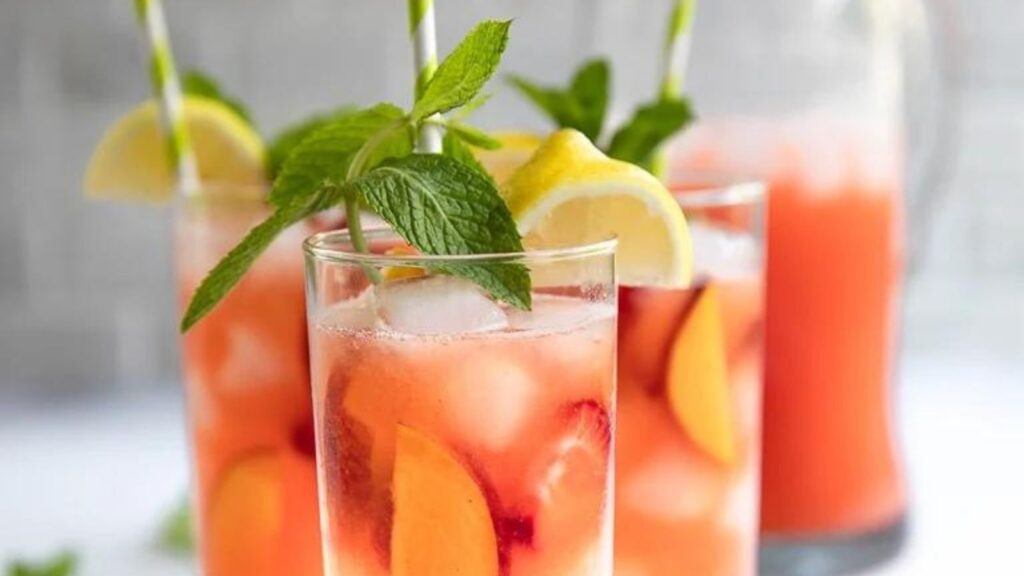 22 Strawberry Recipes You'll Want To Make Again and Again Peach Strawberry Lemonade by The Forked Spoon