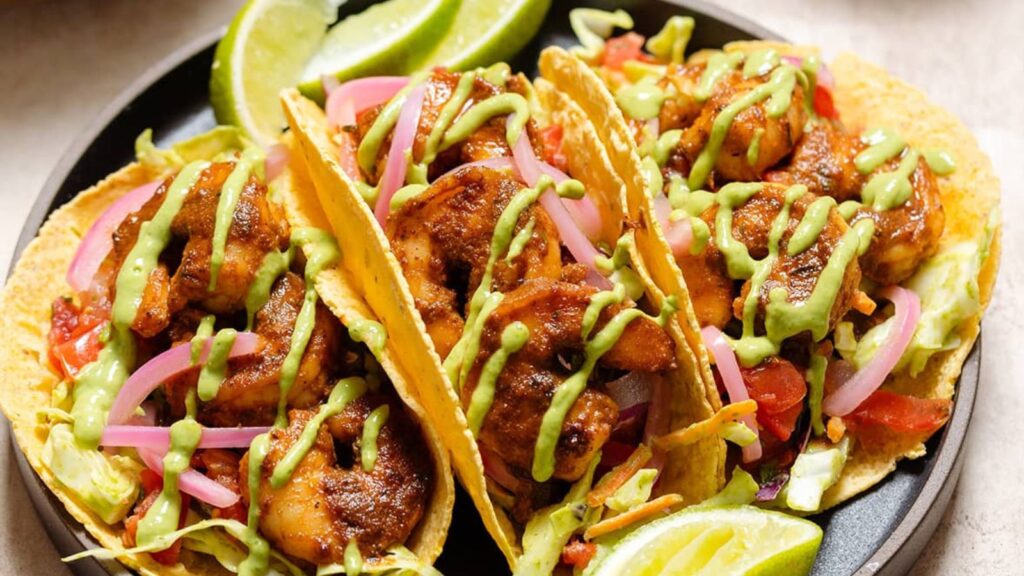 21 Delicious Recipes You'll Want To Make This August Spicy Shrimp Tacos with Creamy Cilantro Sauce by The Healthful Ideas