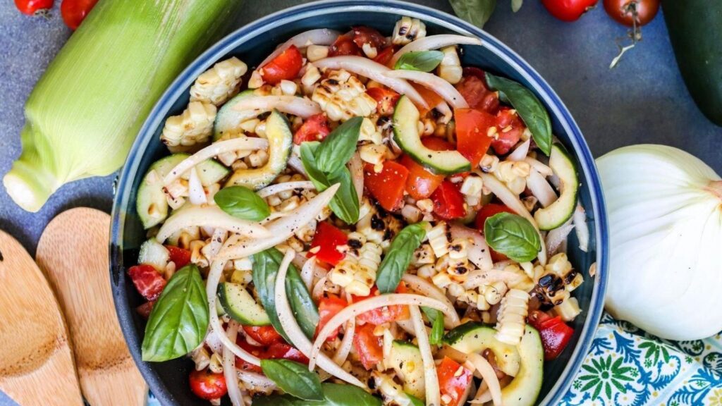 You'll Be All Ears for These 15 Corn-tastic Corn Recipes Tomato Cucumber Corn Salad by Veggies Save The Day