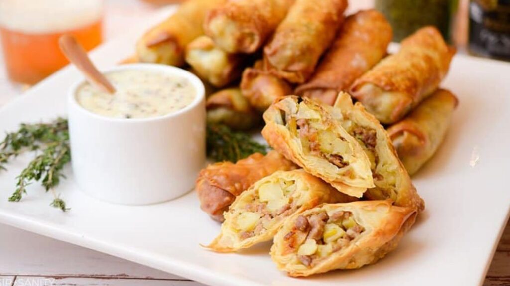 Roll With It: 18 Unique Egg Roll Recipes Dublin Coddle Egg Rolls with Mustard Caper Sauce by Sip and Sanity