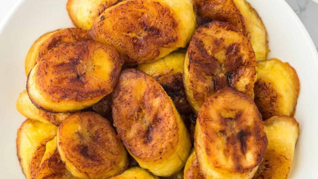 22 Caribbean Dishes That'll Knock Your Flip Flops Off Fried Plantains by Grand Baby Cakes