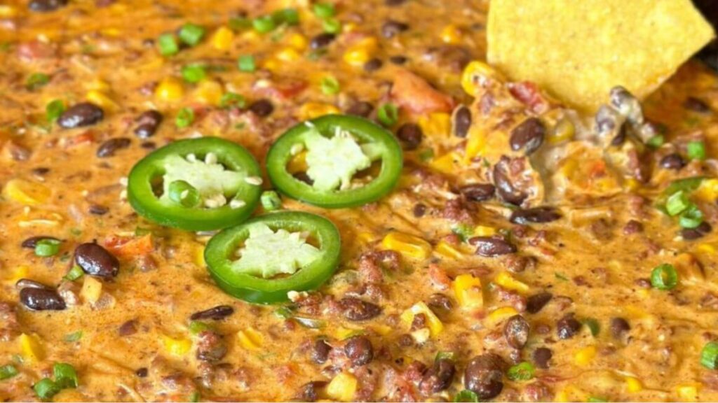 Saddle Up for Flavor: 21 Cowboy Recipes That’ll Have You Hollerin’ For More Loaded Cowboy Queso Dip by Pellets and Pits